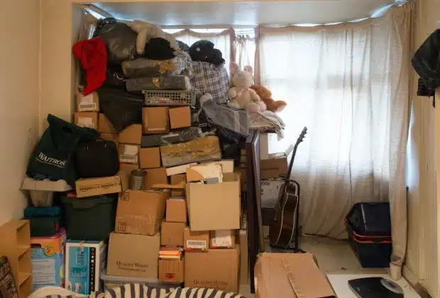 brown cardboard boxes on black steel rack